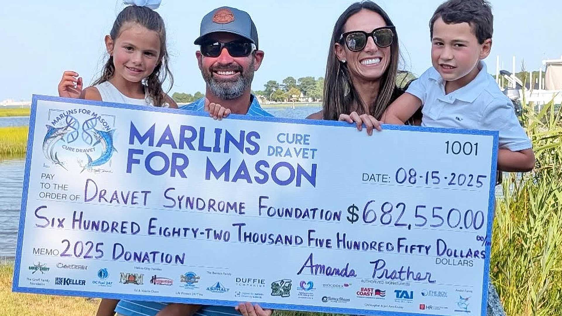 2024 Success, Marlins for Mason, holding huge check